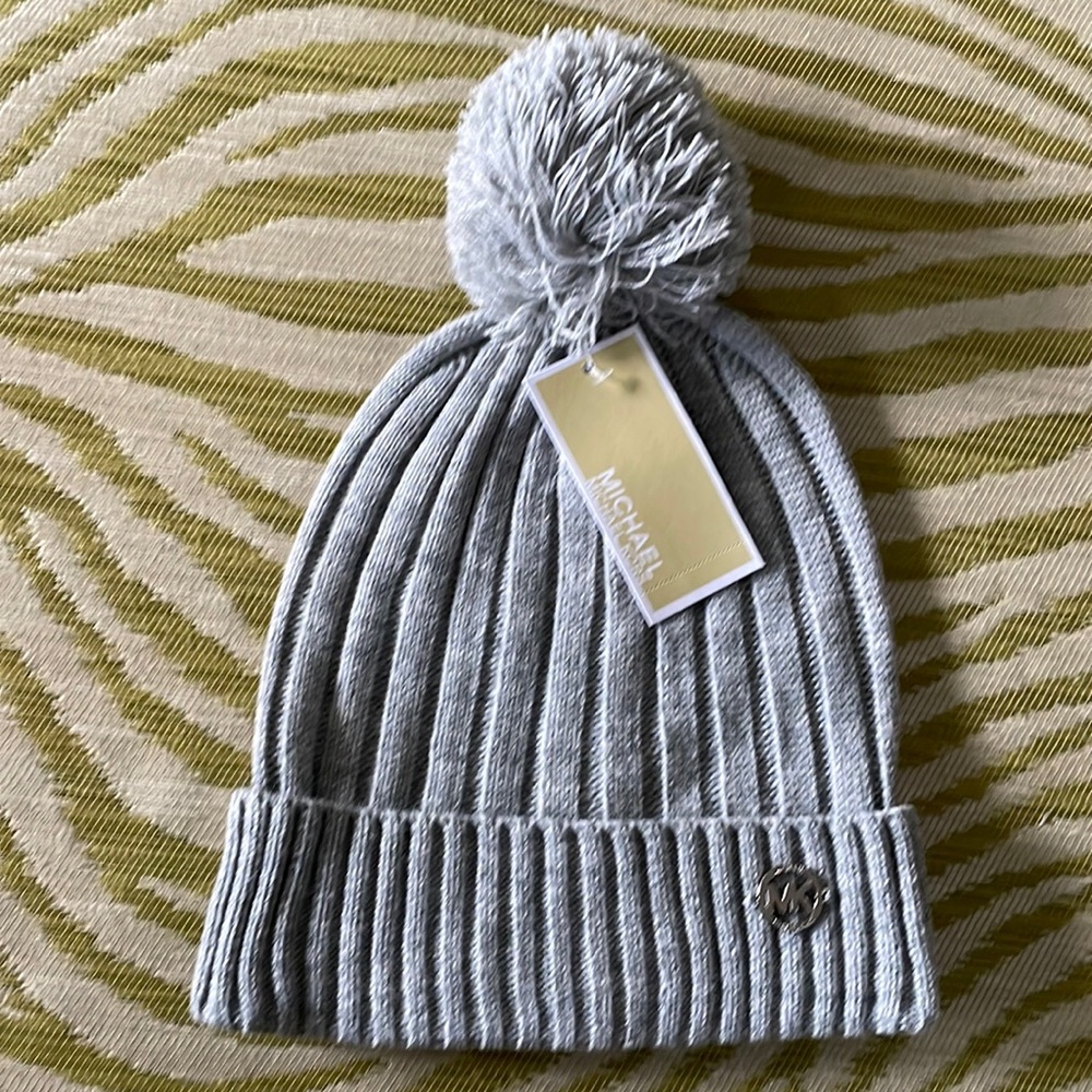 Gray knit beanie hat with stylish MK logo in silver.
